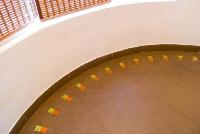 glass tile inlay in the semi circular landing.